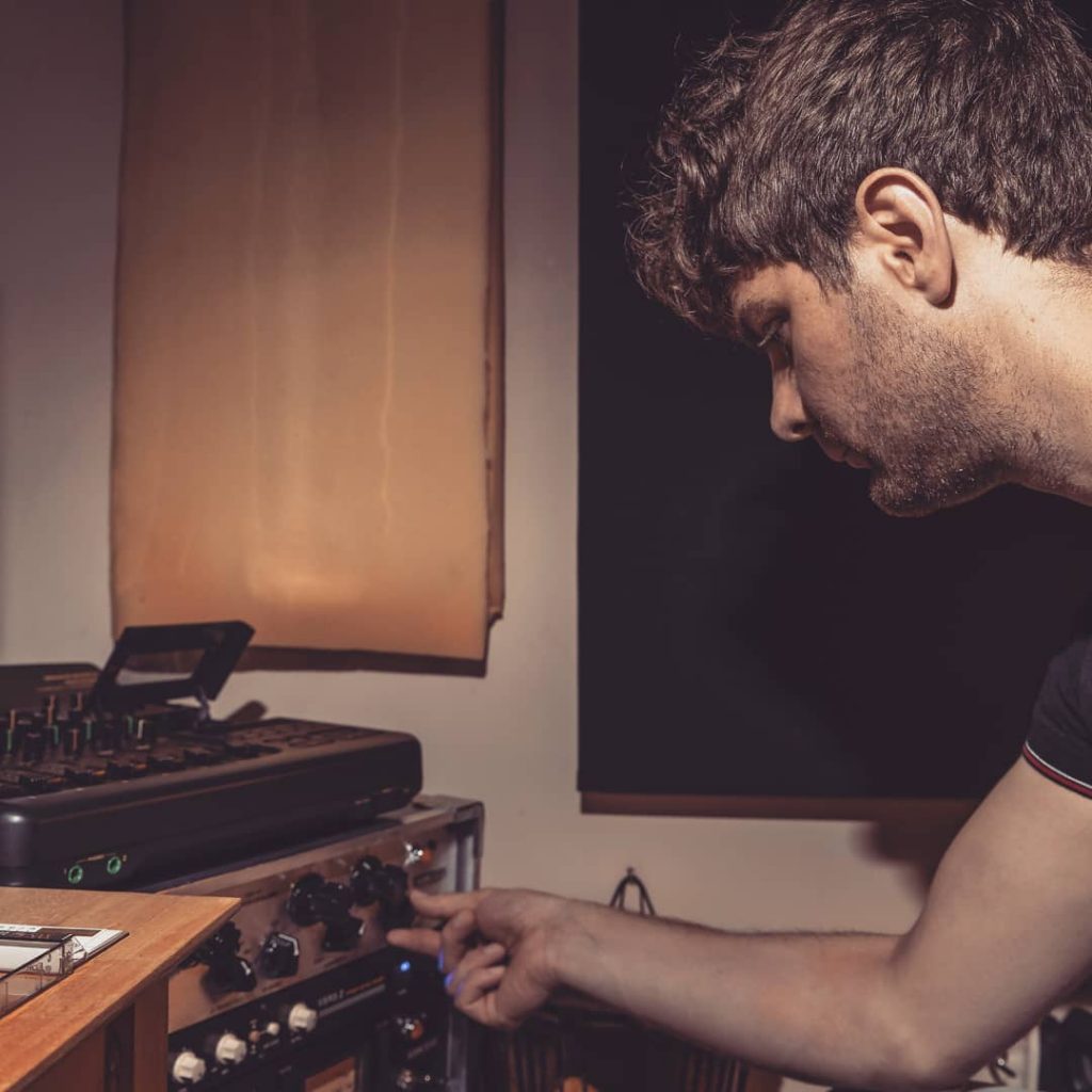 Andy Pickering working on a mix in his analogue studio. Compression, reverb, EQ